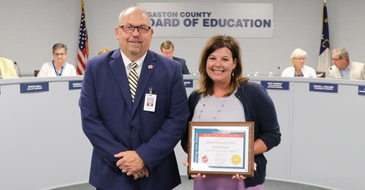 Lowell Elementary teacher Paris Suttenfield pictured with Board Chairman Jeff Ramsey.